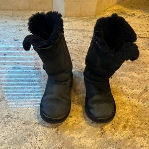 Girls black Ugg boots with 3 button detail on the side